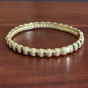 Gold tone textured hinge bracelet